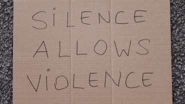 Sign that reads, "Silence allows violence"